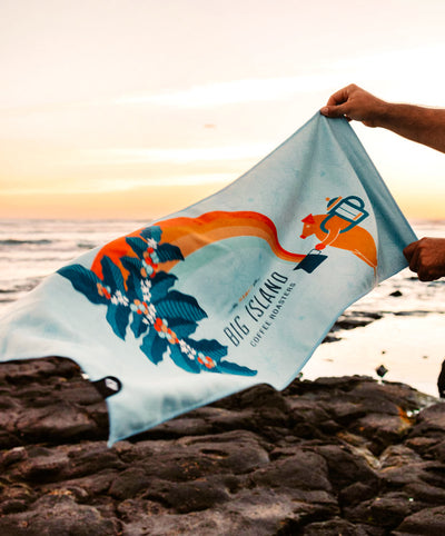 Rainbow Boar Travel Towel by Cafe - Decorative towel with Big Island logo on beach